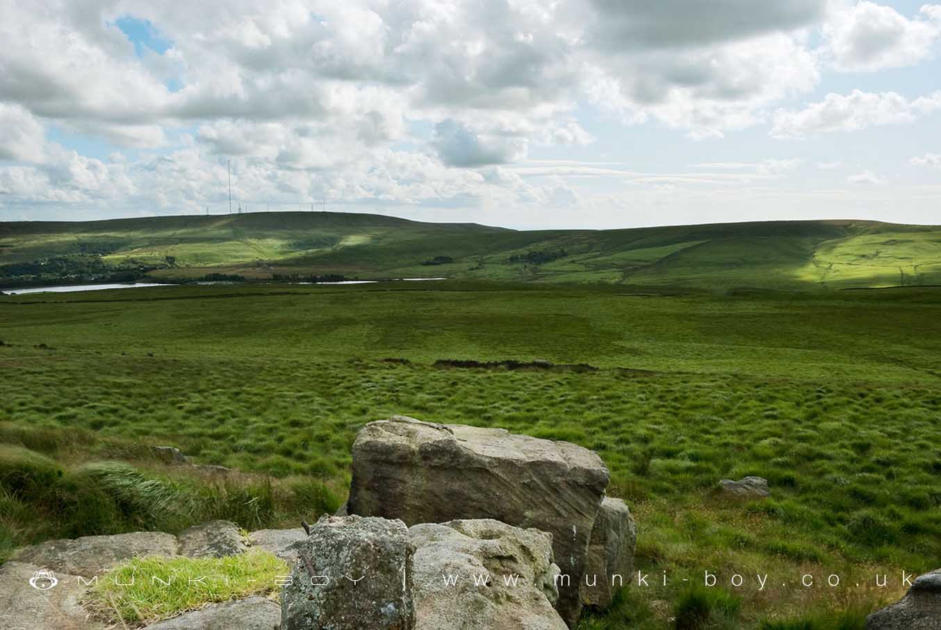 View of Noon Hill from the Giant's Stone on Turton Moor (from where it was said to have been hurled) View of Noon Hill from the Giant's Stone on Turton Moor (from where it was said to have been hurled)